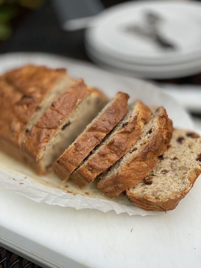 Banana bread with raisins cut into four slices 
