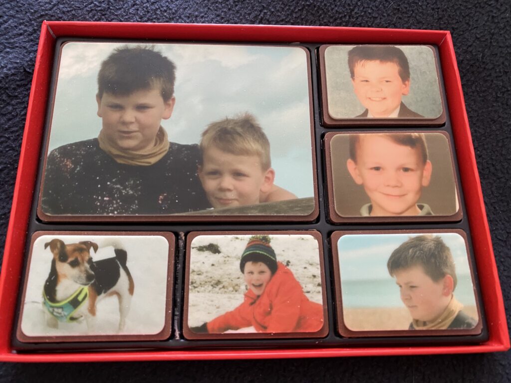 a box of chocolate printed with edible ink with the photos of your choice