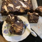 Small plate with fluffernutter brownies with the block of yet to cut behind.