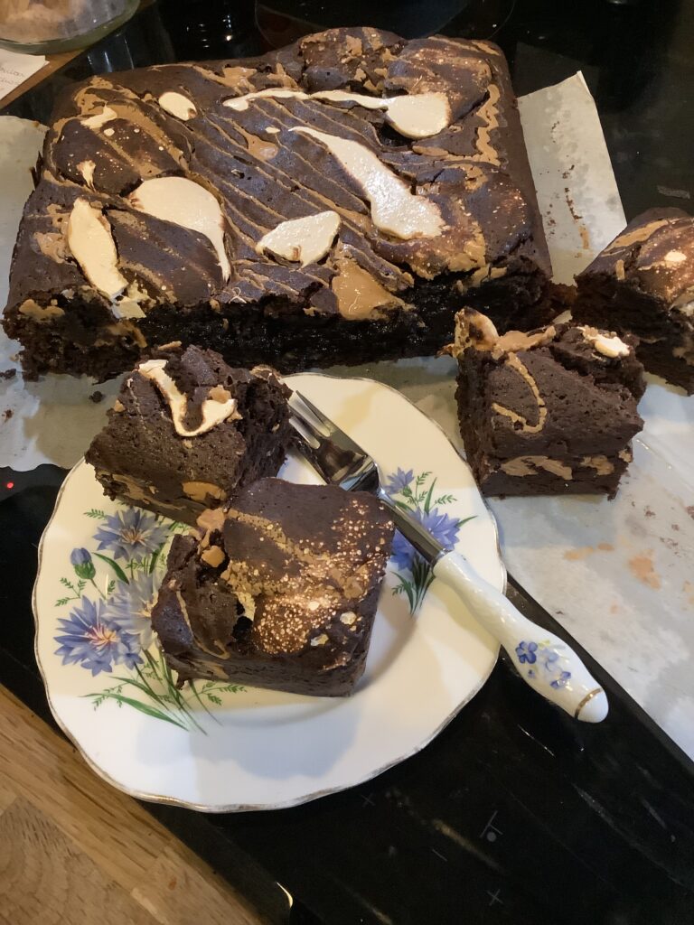 Small plate with fluffernutter brownies with the block of yet to cut behind.