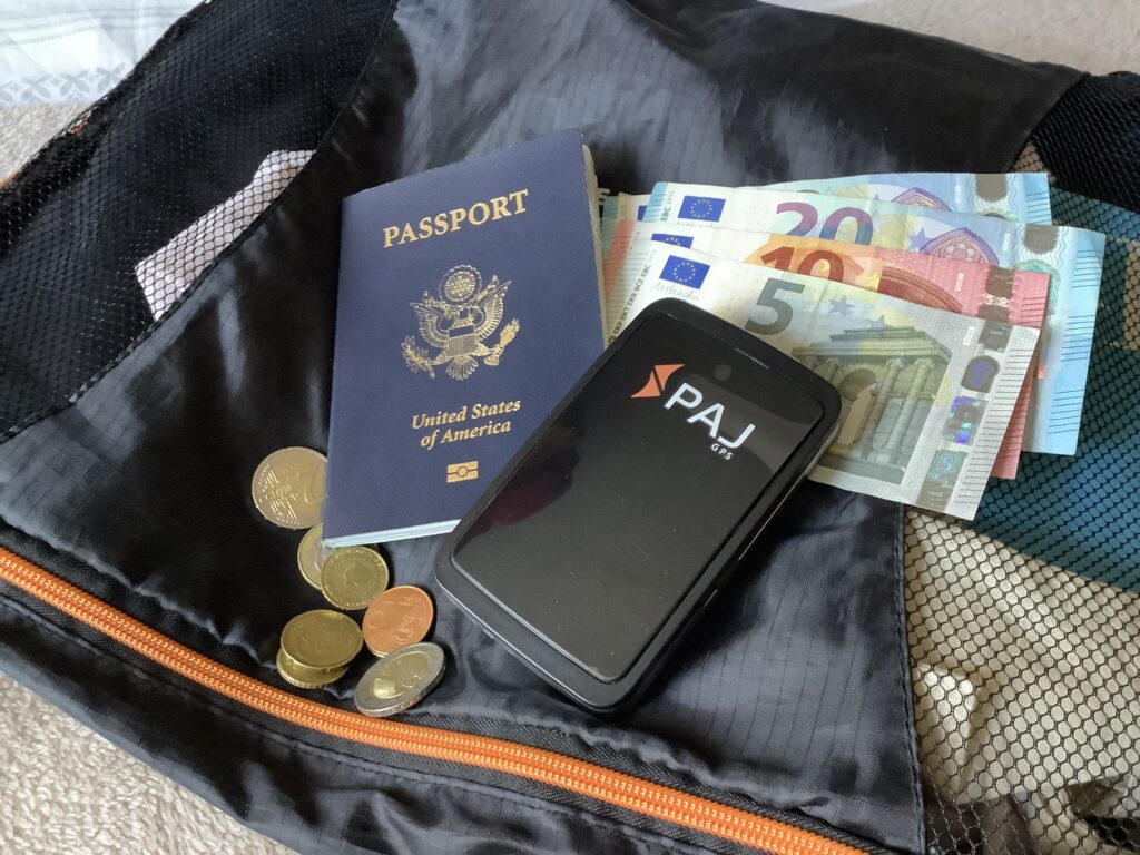 PAJ Finder on top of packing cube with passport and Euros