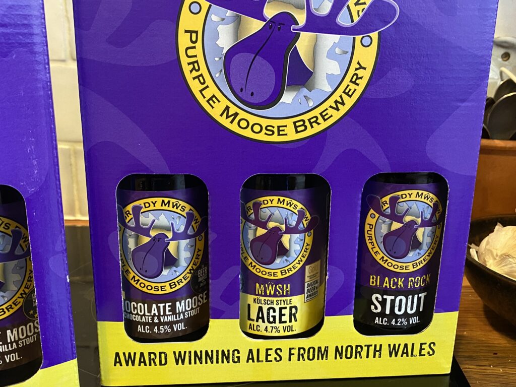 Trio of three bottles of Purple Moose beers to take home